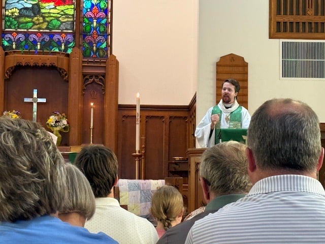 Peter, wearing a green stole, preaching to a congregation about leaning into God's mission Peter, wearing a green stole, preaching to a congregation about leaning into God's mission